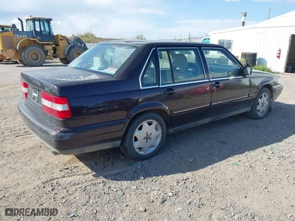 1997 Volvo S90 with VIN YV1KS960XV1115179, listed as a IAAI auction lot 40556853 with 115,660 mi miles. Bid and sale history available at carsss.com. Image 4.
