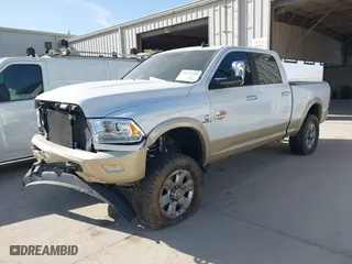2014 Ram 2500 Longhorn with VIN 3C6UR5GLXEG244401, listed as a IAAI auction lot 41779709 with 180,760 mi miles. Bid and sale history available at carsss.com. Image 2.