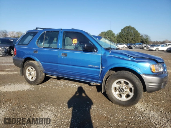 2001 Isuzu Rodeo S with VIN 4S2DM58WX14301336, listed as a Copart auction lot 77770164 with Not provided miles and Salvage title. Bid and sale history available at DreamBid. Image 4.