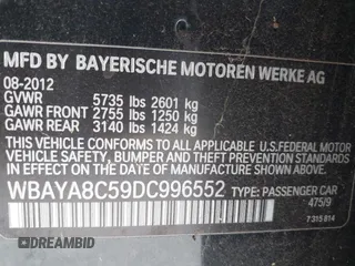 2013 BMW 7 Series 750i with VIN WBAYA8C59DC996552, listed as a IAAI auction lot 41921201 with 99,188 mi miles and . Bid and sale history available at DreamBid. Image 9.