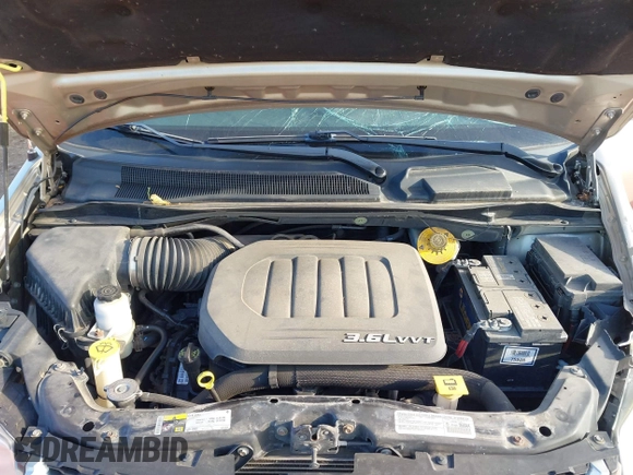 2014 Dodge Grand Caravan SXT with VIN 2C4RDGCG0ER210186, listed as a IAAI auction lot 40813319 with 100,230 mi miles and . Bid and sale history available at DreamBid. Image 10.