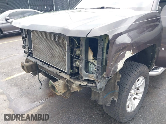 2014 Chevrolet Silverado 1500 LT with VIN 1GCRCREC5EZ161985, listed as a IAAI auction lot 42096479 with 225,412 mi miles and . Bid and sale history available at DreamBid. Image 6.