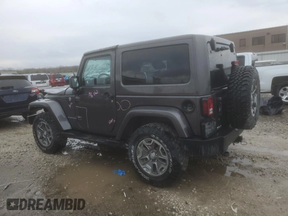 2014 Jeep Wrangler Rubicon with VIN 1C4BJWCG9EL189819, listed as a Copart auction lot 80522204 with 82,083 mi miles and Salvage title. Bid and sale history available at DreamBid. Image 2.