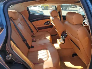 2006 Maserati Quattroporte z VIN ZAMCE39A960023356, wystawiony jako Copart lot #76954384 z przebiegiem 76 185 mil mil oraz Szkody całkowita. Historia ofert i sprzedaży dostępna na DreamBid. Obrazek 10.