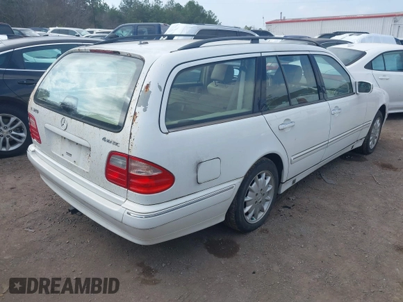 2001 Mercedes-Benz E-Class AWD with VIN WDBJH82J61X057506, listed as a IAAI auction lot 41506666 with 304,332 mi miles. Bid and sale history available at carsss.com. Image 4.