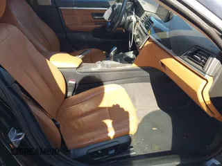 2015 BMW 4 Series 428i with VIN WBA4A5C51FG051393, listed as a IAAI auction lot 42041960 with 136,929 mi miles and . Bid and sale history available at carsss.com. Image 5.