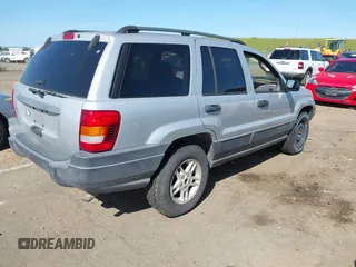 2003 Jeep Grand Cherokee Laredo with VIN 1J4GX48S03C577759, listed as a IAAI auction lot 41969103 with 91,305 mi miles. Bid and sale history available at carsss.com. Image 4.