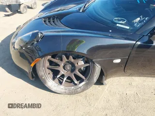 2007 Lotus Elise z VIN SCCPC11167HL32585, wystawiony jako IAAI lot #41438998 z przebiegiem Nie podano mil oraz . Historia ofert i sprzedaży dostępna na DreamBid. Obrazek 16.