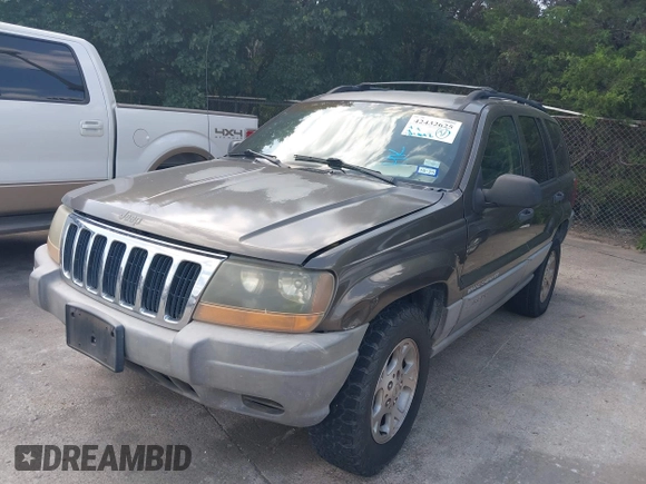 1999 Jeep Grand Cherokee Laredo with VIN 1J4GW58S2XC524365, listed as a IAAI auction lot 42432625 with 284,942 mi miles and . Bid and sale history available at DreamBid. Image 2.
