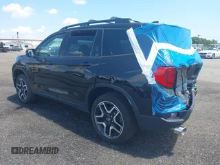 2023 Honda Passport Elite with VIN 5FNYF8H01PB030270, listed as a IAAI auction lot 42667744 with 7,931 mi miles and . Bid and sale history available at DreamBid. Image 3.