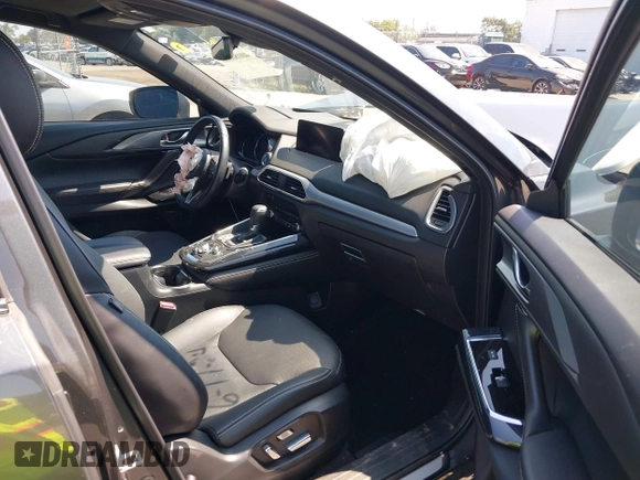2022 Mazda CX-9 Grand Touring with VIN JM3TCBDY4N0618680, listed as a IAAI auction lot 40086806 with 34,142 mi miles and . Bid and sale history available at DreamBid. Image 5.