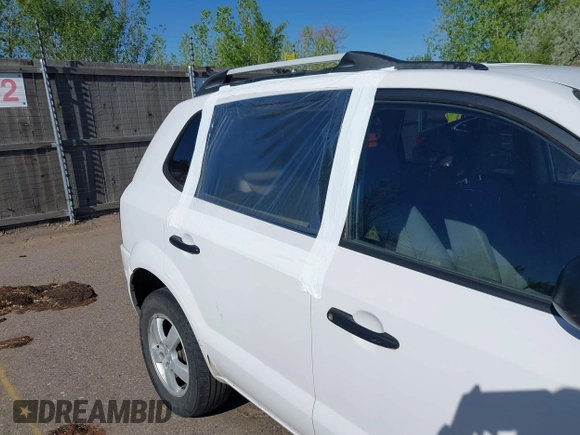 2006 Hyundai Tucson GL with VIN KM8JM72B56U324168, listed as a IAAI auction lot 42146955 with 206,919 mi miles. Bid and sale history available at carsss.com. Image 6.