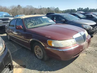 2001 Lincoln Town Car Cartier z VIN 1LNHM83WX1Y732737, wystawiony jako Copart lot #48216445 z przebiegiem 103 262 mil mil oraz Szkoda całkowita • Salvage title. Historia ofert i sprzedaży dostępna na DreamBid. Obrazek 4.