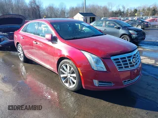 2014 Cadillac XTS Luxury z VIN 2G61N5S34E9163874, wystawiony jako IAAI lot #41649292 z przebiegiem 104 638 mil mil oraz . Historia ofert i sprzedaży dostępna na DreamBid. Obrazek 1.