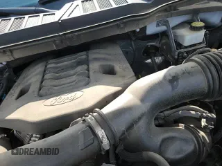 2023 Ford F-150 Lariat with VIN 1FTFW1E89PFA91516, listed as a Copart auction lot 61666315 with 65,711 mi miles and Salvage title. Bid and sale history available at DreamBid. Image 13.