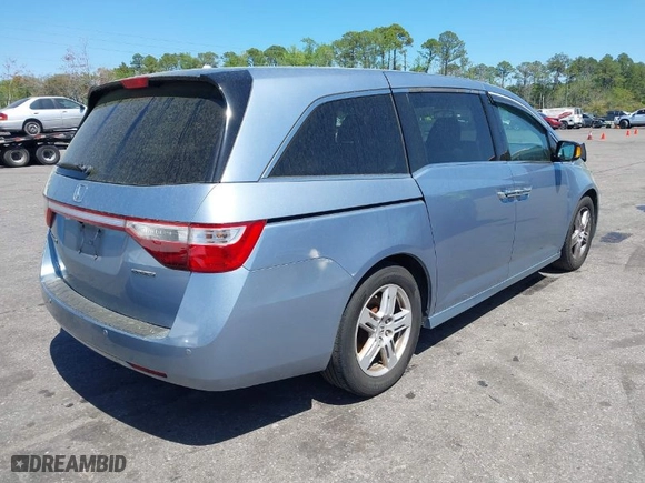 2013 Honda Odyssey Touring with VIN 5FNRL5H94DB069716, listed as a IAAI auction lot 41901369 with 243,492 mi miles. Bid and sale history available at carsss.com. Image 4.