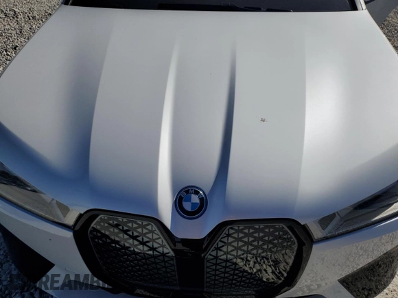 2024 BMW iX M60 with VIN WB533CF04RCP50036, listed as a Copart auction lot 47402505 with 9,345 mi miles and Salvage Title. Bid and sale history available at carsss.com. Image 13.