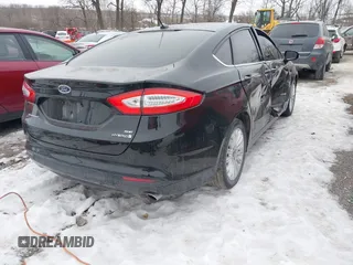 2014 Ford Fusion SE Hybrid with VIN 3FA6P0LUXER236740, listed as a IAAI auction lot 41399510 with 82,720 mi miles. Bid and sale history available at carsss.com. Image 4.