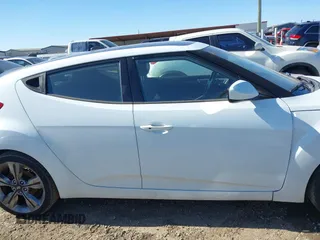2016 Hyundai Veloster z VIN KMHTC6AD3GU267365, wystawiony jako IAAI lot #41469796 z przebiegiem 111 791 mil mil oraz . Historia ofert i sprzedaży dostępna na DreamBid. Obrazek 14.
