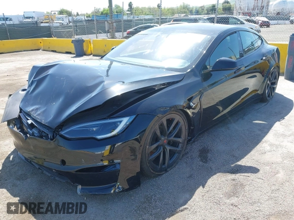 2022 Tesla Model S Plaid with VIN 5YJSA1E61NF483354, listed as a IAAI auction lot 41973636 with 32,541 mi miles and . Bid and sale history available at DreamBid. Image 20.