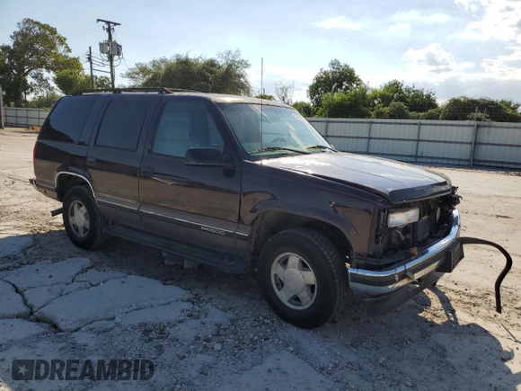 1997 GMC Yukon with VIN 1GKEK13R7VJ711782, listed as a Copart auction lot 74793184 with 208,718 mi miles and Salvage Title. Bid and sale history available at carsss.com. Image 4.