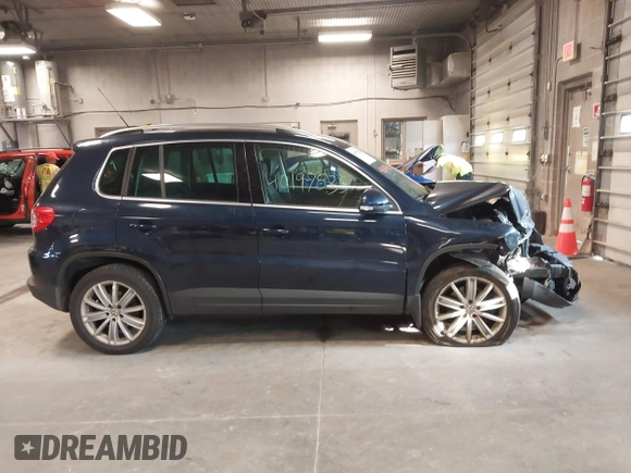 2011 Volkswagen Tiguan SE with VIN WVGBV7AXXBW533872, listed as a IAAI auction lot 40197835 with 104,685 mi miles and . Bid and sale history available at DreamBid. Image 13.