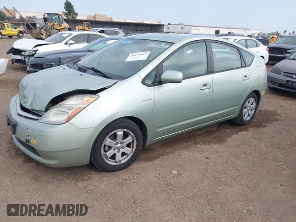 2006 Toyota Prius z VIN JTDKB20U963131145, wystawiony jako IAAI lot #41857847 z przebiegiem 113 251 mil mil oraz . Historia ofert i sprzedaży dostępna na DreamBid. Obrazek 2.