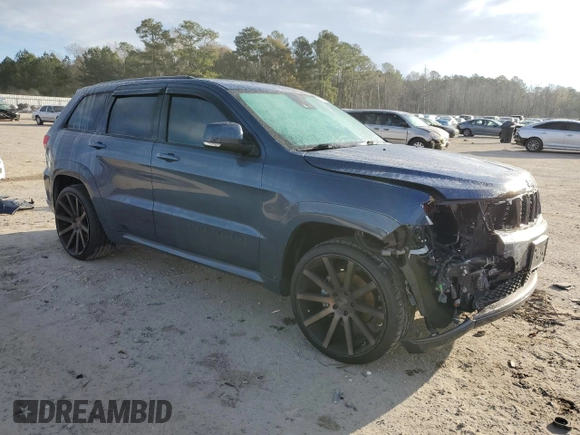 2020 Jeep Grand Cherokee Overland with VIN 1C4RJFCG8LC414033, listed as a Copart auction lot 87403024 with 55,111 mi miles and Salvage Title. Bid and sale history available at carsss.com. Image 4.