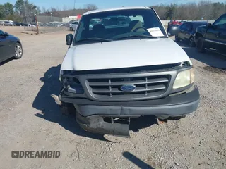 2003 Ford F-150 XL with VIN 2FTRF17W03CA59388, listed as a IAAI auction lot 41673651 with 221,668 mi miles. Bid and sale history available at carsss.com. Image 6.