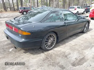 1995 Ford Probe z VIN 1ZVLT22B1S5104093, wystawiony jako IAAI lot #41744654 z przebiegiem 166 253 mil mil oraz . Historia ofert i sprzedaży dostępna na DreamBid. Obrazek 4.