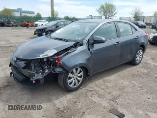 2015 Toyota Corolla L with VIN 2T1BURHE1FC381115, listed as a IAAI auction lot 42088980 with 203,493 mi miles and . Bid and sale history available at DreamBid. Image 2.