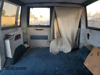1986 GMC Safari z VIN 1GDDM15Z1GB521872, wystawiony jako Copart lot #87655995 z przebiegiem 30 889 mil mil oraz Szkody całkowita. Historia ofert i sprzedaży dostępna na DreamBid. Obrazek 10.