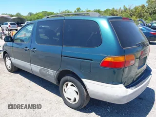 1998 Toyota Sienna LE with VIN 4T3ZF13C0WU038446, listed as a IAAI auction lot 42038331 with 228,832 mi miles. Bid and sale history available at carsss.com. Image 3.