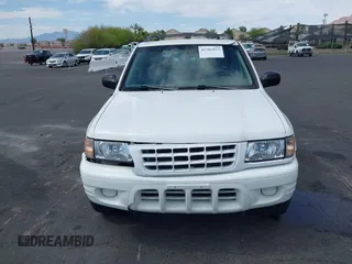 2001 Isuzu Rodeo S z VIN 4S2CK58W614329085, wystawiony jako IAAI lot #42303013 z przebiegiem 171 933 mil mil oraz . Historia ofert i sprzedaży dostępna na DreamBid. Obrazek 12.
