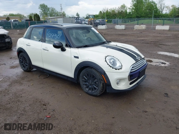 2015 MINI Hardtop 4 Door with VIN WMWXS5C52FT831291, listed as a IAAI auction lot 42179801 with 63,261 mi miles and . Bid and sale history available at DreamBid. Image 1.