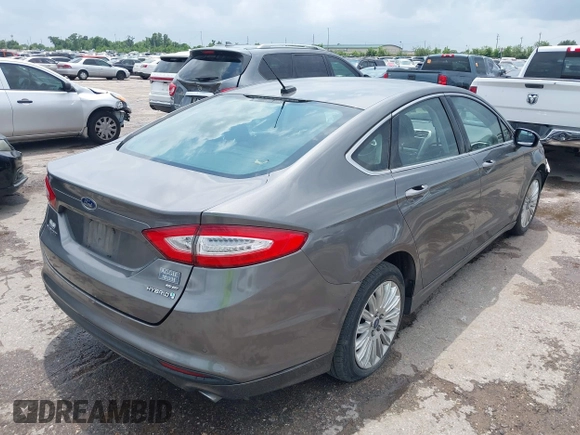 2013 Ford Fusion SE Hybrid with VIN 3FA6P0LU9DR247484, listed as a IAAI auction lot 42110685 with 202,531 mi miles. Bid and sale history available at carsss.com. Image 4.