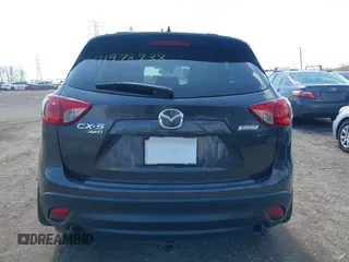 2016 Mazda CX-5 Touring with VIN JM3KE4CYXG0620990, listed as a IAAI auction lot 41978738 with 91,237 mi miles and . Bid and sale history available at carsss.com. Image 16.