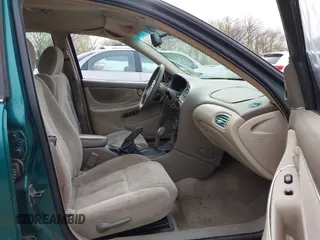 1999 Oldsmobile Alero GL z VIN 1G3NL52T7XC398799, wystawiony jako IAAI lot #41911602 z przebiegiem 252 504 mil mil oraz . Historia ofert i sprzedaży dostępna na DreamBid. Obrazek 5.
