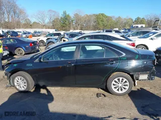 2015 Toyota Camry Hybrid LE with VIN 4T1BD1FK7FU167027, listed as a IAAI auction lot 41697235 with 253,152 mi miles. Bid and sale history available at carsss.com. Image 14.