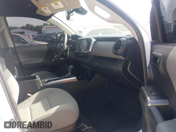 2023 Toyota Tacoma SR with VIN 3TYCZ5AN2PT112854, listed as a IAAI auction lot 42220025 with 43,657 mi miles and . Bid and sale history available at DreamBid. Image 5.