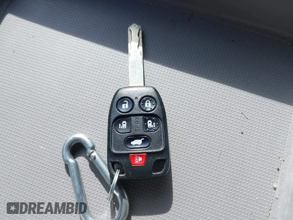 2012 Honda Odyssey Touring with VIN 5FNRL5H95CB063003, listed as a IAAI auction lot 41871975 with 179,332 mi miles and . Bid and sale history available at DreamBid. Image 11.