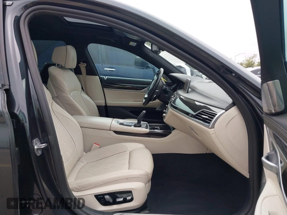 2019 BMW 7 Series 750i with VIN WBA7F0C50KGM26010, listed as a IAAI auction lot 42188421 with 71,576 mi miles and . Bid and sale history available at DreamBid. Image 5.