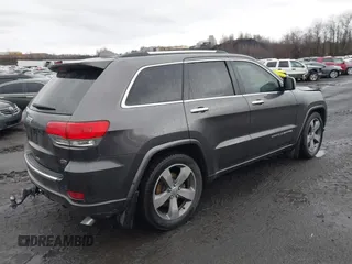2015 Jeep Grand Cherokee Overland with VIN 1C4RJFCT3FC725239, listed as a IAAI auction lot 41779555 with 100,837 mi miles. Bid and sale history available at carsss.com. Image 4.