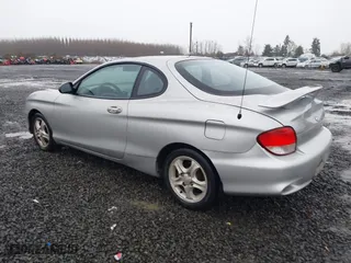 2001 Hyundai Tiburon with VIN KMHJG25F81U267658, listed as a IAAI auction lot 41092438 with 188,575 mi miles. Bid and sale history available at carsss.com. Image 3.