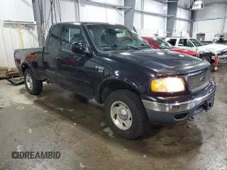 2000 Ford F-150 XL with VIN 1FTRX18L7YNA85909, listed as a Copart auction lot 56056165 with 134,765 mi miles and Salvage title. Bid and sale history available at DreamBid. Image 4.