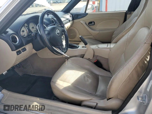 2003 Mazda MX-5 Miata Cloth z VIN JM1NB353X30311086, wystawiony jako Copart lot #57685445 z przebiegiem 141 634 mil mil oraz Szkoda całkowita • Salvage title. Historia ofert i sprzedaży dostępna na DreamBid. Obrazek 7.