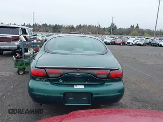 1999 Ford Taurus z VIN 1FAFP52S9XG309250, wystawiony jako IAAI lot #41797222 z przebiegiem 102 676 mil mil oraz . Historia ofert i sprzedaży dostępna na DreamBid. Obrazek 16.