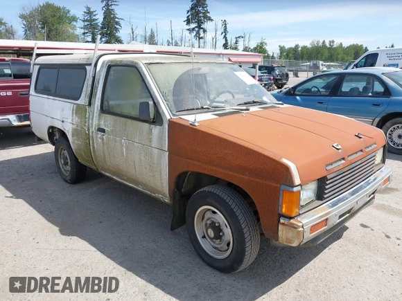 1987 Nissan Hardbody E z VIN JN6ND11S1HW047821, wystawiony jako IAAI lot #42210912 z przebiegiem 162 721 mil mil oraz . Historia ofert i sprzedaży dostępna na DreamBid. Obrazek 1.
