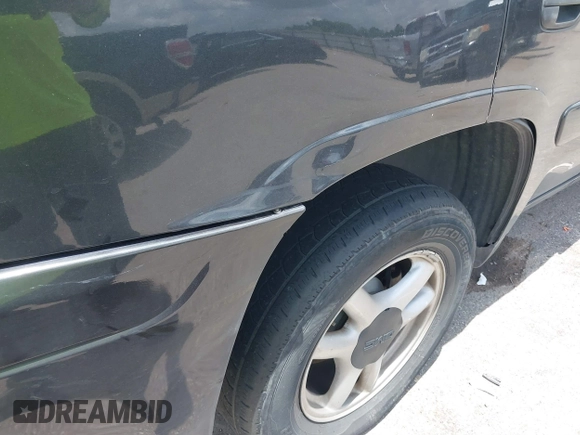 2005 GMC Envoy SLE with VIN 1GKDS13SX52373187, listed as a IAAI auction lot 42434190 with 112,965 mi miles and . Bid and sale history available at DreamBid. Image 13.