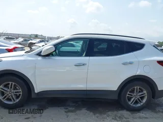 2018 Hyundai Santa Fe 2.4L z VIN 5NMZUDLB3JH055771, wystawiony jako IAAI lot #42126058 z przebiegiem 142 991 mil mil oraz . Historia ofert i sprzedaży dostępna na DreamBid. Obrazek 14.